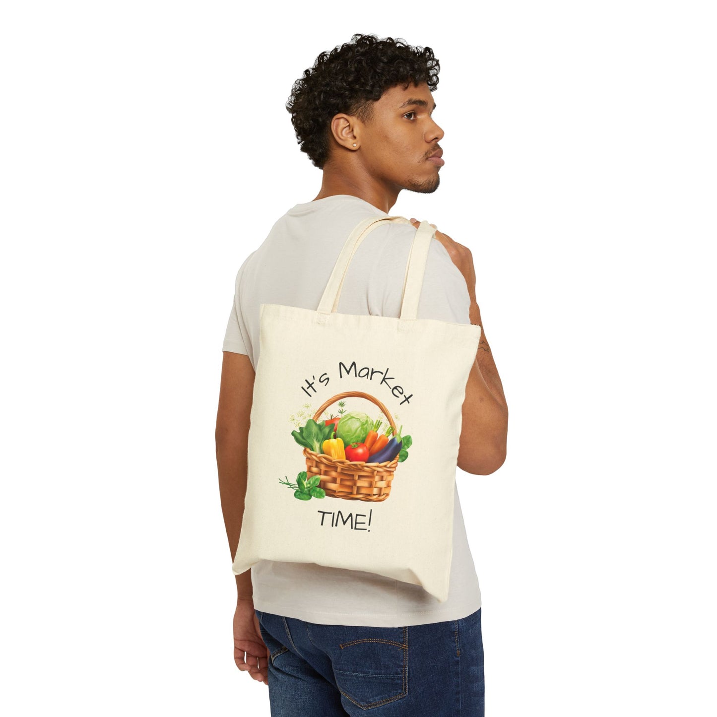 Man carrying a tote bag with a vegetable graphic and text on a white background