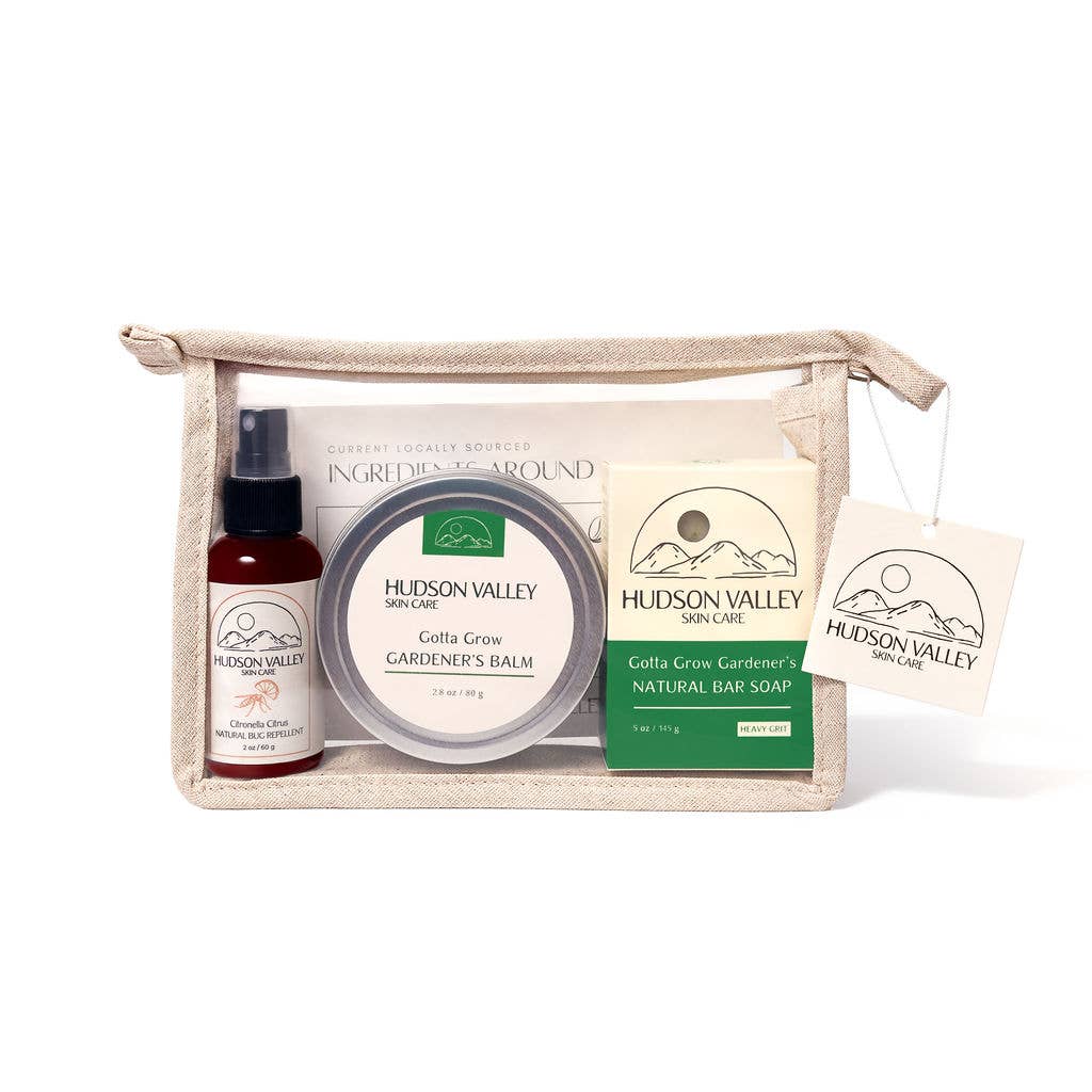 Hudson Valley skincare products including a bottle, balm, soap, and pouch on a white background