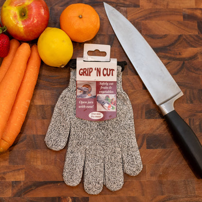Grip 'N Cut gloves on a wooden surface with fruits and vegetables