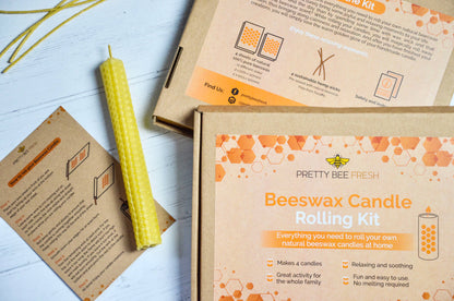 Pretty Bee Fresh Beeswax Candle Rolling Kit with a yellow candle and packaging on a light surface.